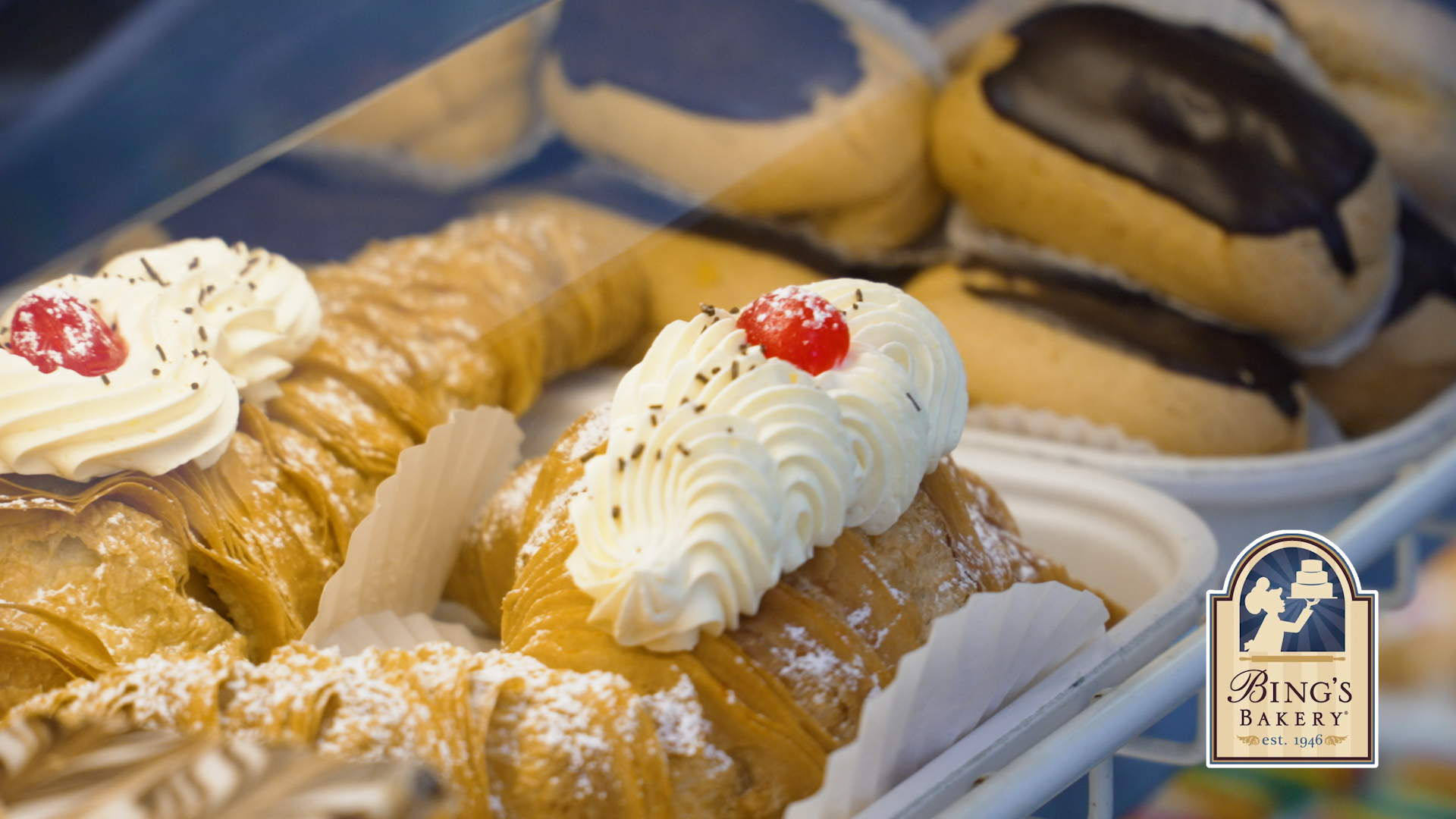 Bings Bakery cannolis and cream puffs in the pastry case